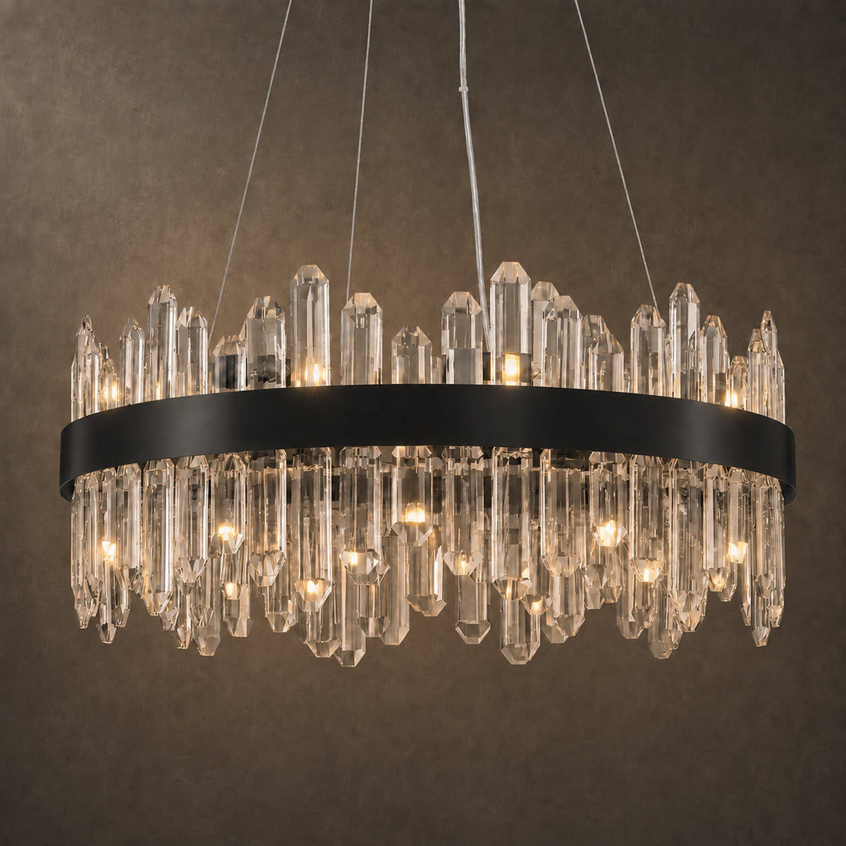 The same round black chandelier illuminated