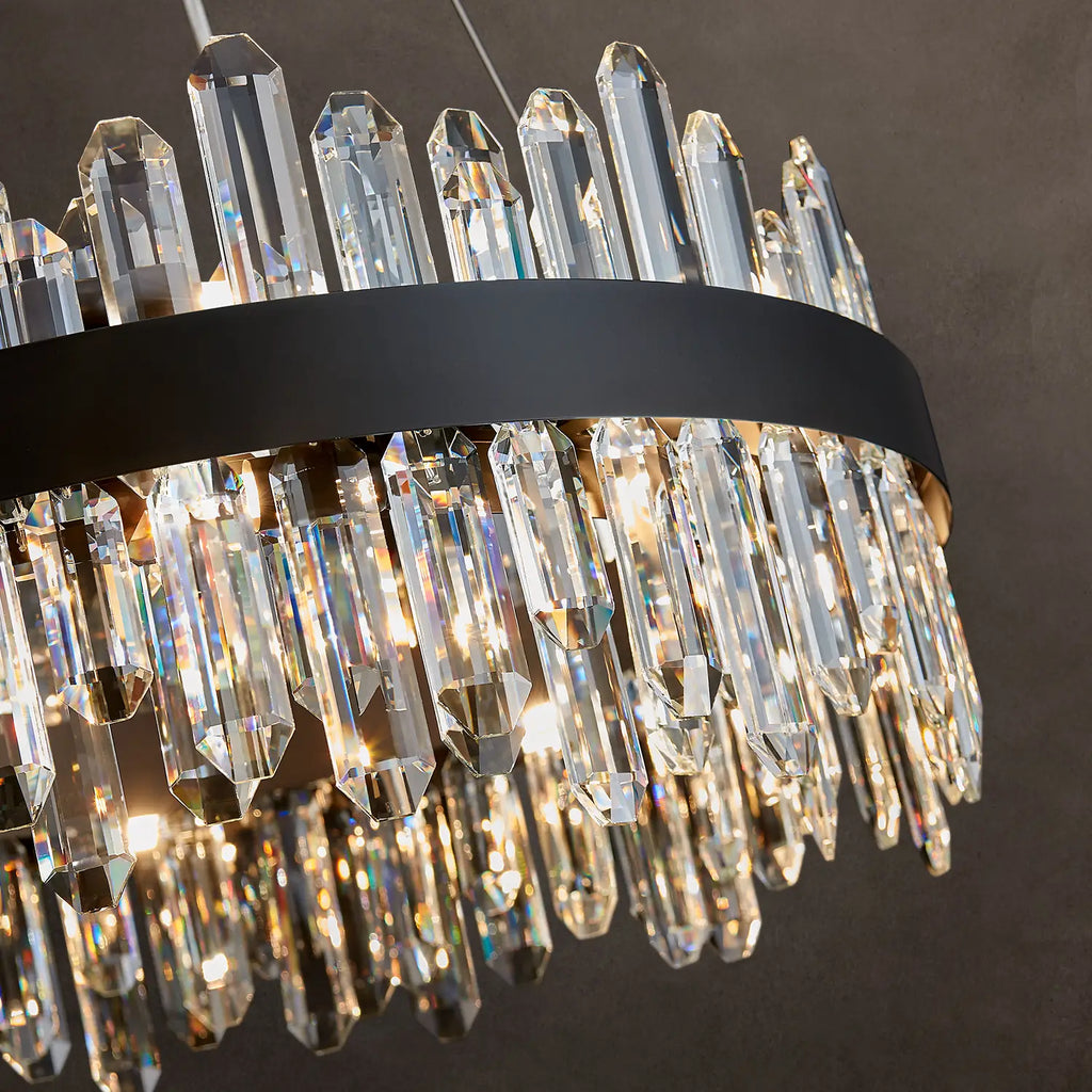 Close-up of black frame and K9 crystal prisms on round chandelier