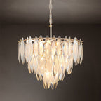 Medium gold K9 crystal chandelier hanging on dark background
