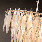 Close-up of leaf-shaped K9 crystal panels on chandelier